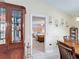 Dining room view into bedroom with ceiling fan and tiled flooring at 716 Maderia Ct, Kissimmee, FL 34758