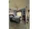 Cozy bedroom with tiled floors, a ceiling fan, and blue accents at 716 Maderia Ct, Kissimmee, FL 34758