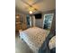 Cozy bedroom featuring tile floors and an ensuite bathroom through the doorway at 716 Maderia Ct, Kissimmee, FL 34758