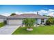 Inviting single-Gathering home with a well-manicured lawn and mature landscaping at 716 Maderia Ct, Kissimmee, FL 34758