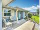 Inviting front porch with seating, a 'Welcome' sign, and charming decorative touches at 716 Maderia Ct, Kissimmee, FL 34758