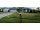 Charming single-story home features a well-maintained front yard, a garage, and a mailbox at 716 Maderia Ct, Kissimmee, FL 34758