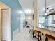 Hallway with tile floor leading to kitchen and front door at 716 Maderia Ct, Kissimmee, FL 34758
