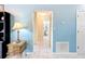 Hallway view features tiled flooring and easy access to bedrooms and baths at 716 Maderia Ct, Kissimmee, FL 34758