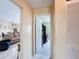 Hallway view towards the living room, dining room and an office area in the back at 716 Maderia Ct, Kissimmee, FL 34758