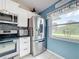 Modern kitchen features stainless steel appliances, granite counters and stylish backsplash at 716 Maderia Ct, Kissimmee, FL 34758