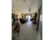 Open living area with tile floors and view to a backyard pool at 716 Maderia Ct, Kissimmee, FL 34758