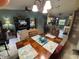 Open-concept living and dining area, offering a view of the kitchen at 716 Maderia Ct, Kissimmee, FL 34758