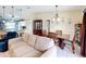Living room and dining area view leads to kitchen and breakfast bar at 716 Maderia Ct, Kissimmee, FL 34758