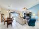 Spacious living room with tile floors and view of the pool at 716 Maderia Ct, Kissimmee, FL 34758