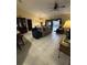 Comfortable living room area with tile flooring and neutral colors at 716 Maderia Ct, Kissimmee, FL 34758