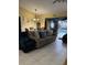 Cozy living room area with a dining table and access to the backyard at 716 Maderia Ct, Kissimmee, FL 34758