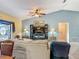 Open living area, including a view of the television, dining room, and sliding glass doors at 716 Maderia Ct, Kissimmee, FL 34758