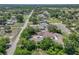 Aerial view of the property surrounded by trees and other homes at 9019 Oakwood Dr, Lake Wales, FL 33898