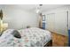 Light bedroom with tile floors, neutral colors, and closet at 9019 Oakwood Dr, Lake Wales, FL 33898