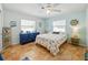 Charming bedroom with coastal decor, light blue walls and tile flooring at 9019 Oakwood Dr, Lake Wales, FL 33898