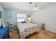 Bright bedroom featuring tile floors, a ceiling fan and a nautical theme at 9019 Oakwood Dr, Lake Wales, FL 33898