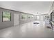 Large bonus room with multiple windows and doors, perfect for a flexible living space or recreation area at 9019 Oakwood Dr, Lake Wales, FL 33898