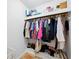 Walk-in closet with shelving, hanging rods, and tiled floors at 9019 Oakwood Dr, Lake Wales, FL 33898