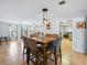 Charming dining area with tile flooring, modern lighting, and seamless flow to the living spaces at 9019 Oakwood Dr, Lake Wales, FL 33898