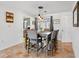 Inviting dining area featuring tile flooring and modern pendant lighting at 9019 Oakwood Dr, Lake Wales, FL 33898