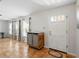 Bright entryway featuring tile flooring, natural light, and a stylish storage unit at 9019 Oakwood Dr, Lake Wales, FL 33898