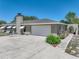 Charming single-story home with attached two-car garage and a wide driveway at 9019 Oakwood Dr, Lake Wales, FL 33898
