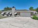 Charming single-story home with attached two-car garage and a wide driveway at 9019 Oakwood Dr, Lake Wales, FL 33898