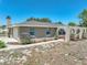 Exterior of a single-story home with a charming covered patio featuring arched openings at 9019 Oakwood Dr, Lake Wales, FL 33898