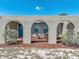 Inviting outdoor living space with quaint patio furniture and unique arched design, perfect for relaxation at 9019 Oakwood Dr, Lake Wales, FL 33898