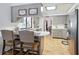 Well-lit kitchen with breakfast bar, stainless steel appliances, and tiled floors at 9019 Oakwood Dr, Lake Wales, FL 33898