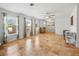 Spacious living room with tile floors, neutral walls, and ample natural light from large windows at 9019 Oakwood Dr, Lake Wales, FL 33898