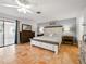 Comfortable bedroom with tile floors, soothing paint, and great natural light at 9019 Oakwood Dr, Lake Wales, FL 33898