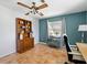 Spacious office with rustic cabinet, ceiling fan and tile flooring at 9019 Oakwood Dr, Lake Wales, FL 33898