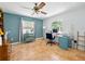 Home office featuring tile floors, a desk, and bright window at 9019 Oakwood Dr, Lake Wales, FL 33898