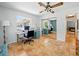 Home office featuring tile floors, desk, and bright windows at 9019 Oakwood Dr, Lake Wales, FL 33898