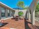 Cozy patio featuring outdoor seating and a stylish umbrella, ideal for enjoying sunny days at 9019 Oakwood Dr, Lake Wales, FL 33898