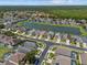 Aerial view of neighborhood with lakeside homes at 936 Lake Berkley Dr, Kissimmee, FL 34746