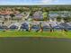 Beautiful lakefront home features a screened pool and well-manicured lawn at 936 Lake Berkley Dr, Kissimmee, FL 34746