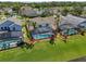 Private backyard with screened-in pool and lush lawn at 936 Lake Berkley Dr, Kissimmee, FL 34746
