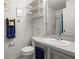 Bathroom featuring a shower, toilet, and single sink vanity at 936 Lake Berkley Dr, Kissimmee, FL 34746