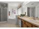 Bright bathroom featuring a large tub, shower, and single sink vanity at 936 Lake Berkley Dr, Kissimmee, FL 34746