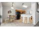 Bright kitchen and dining area features tile flooring, wooden cabinets, and modern black appliances at 936 Lake Berkley Dr, Kissimmee, FL 34746