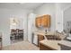 Bright kitchen featuring stainless steel appliances, and breakfast bar, which opens to the dining area at 936 Lake Berkley Dr, Kissimmee, FL 34746