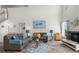 Spacious living area with plush sofas, stylish accents, and ample natural light creating a cozy atmosphere at 936 Lake Berkley Dr, Kissimmee, FL 34746