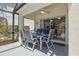 Covered outdoor patio with stylish table, seating, and pool view at 936 Lake Berkley Dr, Kissimmee, FL 34746