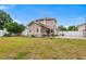 Expansive backyard with a well-maintained lawn and a white fence, offering plenty of outdoor space at 102 Deen Blvd, Auburndale, FL 33823