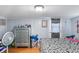 Cozy bedroom featuring a large dresser, stylish bedding, and ample natural light at 102 Deen Blvd, Auburndale, FL 33823