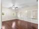 Bedroom featuring hardwood floors, multiple windows and a ceiling fan at 102 Deen Blvd, Auburndale, FL 33823