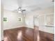 Bedroom featuring hardwood floors, multiple windows and a ceiling fan at 102 Deen Blvd, Auburndale, FL 33823